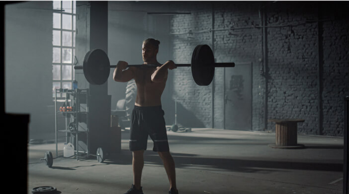 man lifting weights